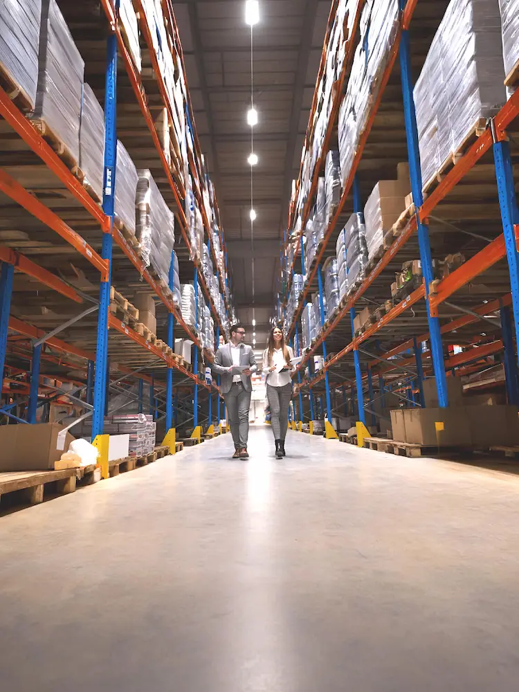 Warehouse supply employees discussing account management