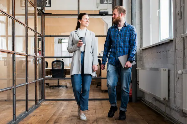2 young people walking though a facility